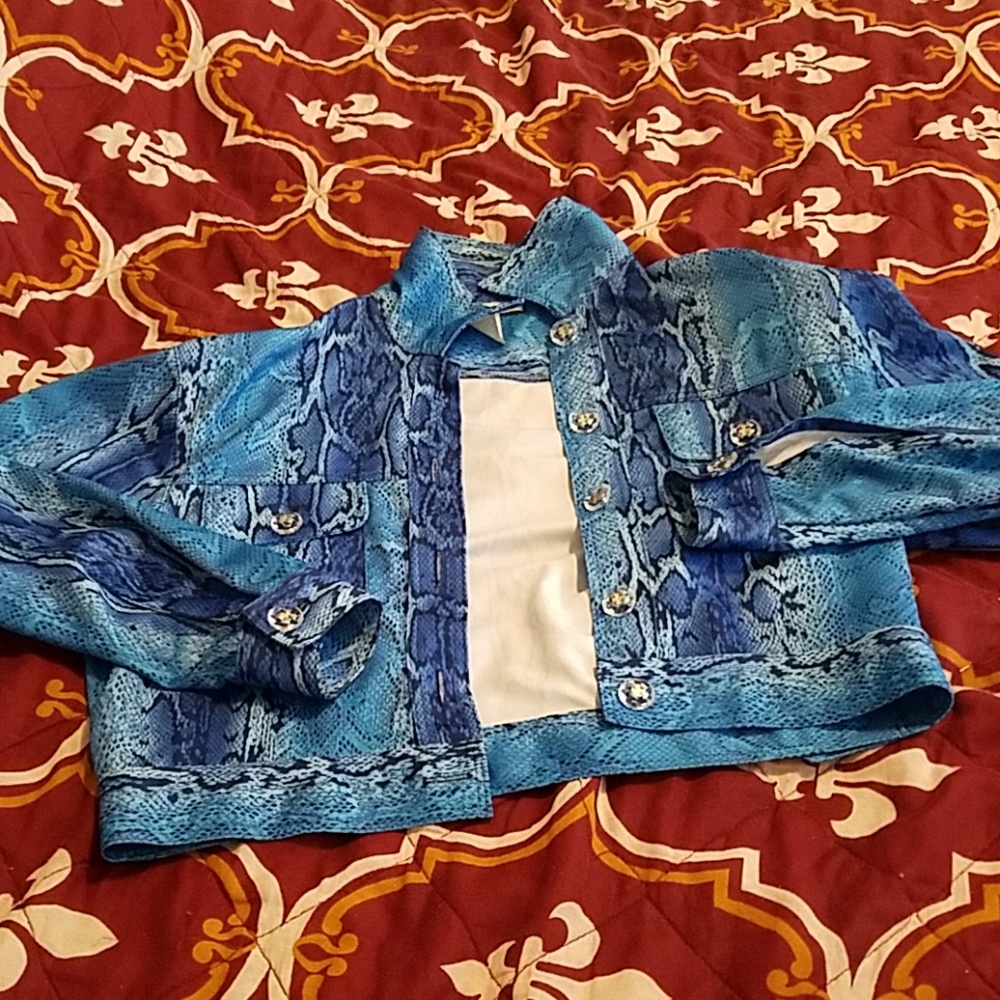 A woman's jacket and pants outfit